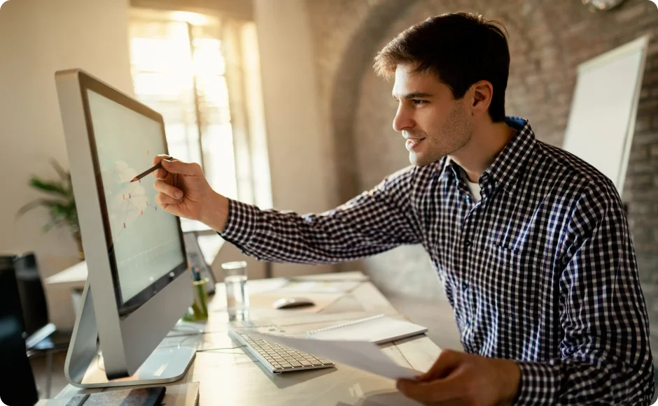 Engineer reviewing utility software on a desktop monitor